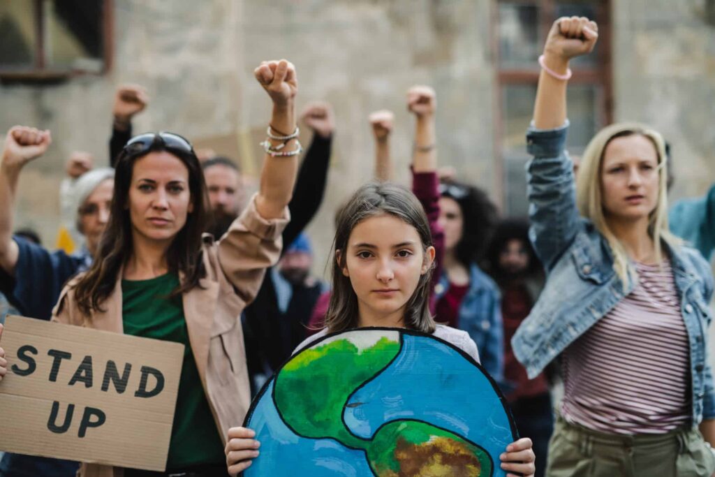Women and girls standing up against climate change. ESG Investing Denver Liz Windisch