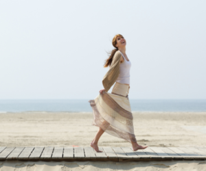 woman walking on beach