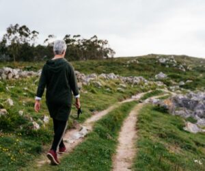 woman walking through mountains