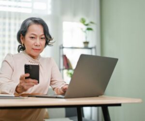 older woman working on computer